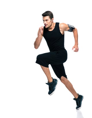 Full length portrait of a fitness man running isolated on a white background.jpeg