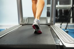 Image of female foot running on treadmill.jpeg